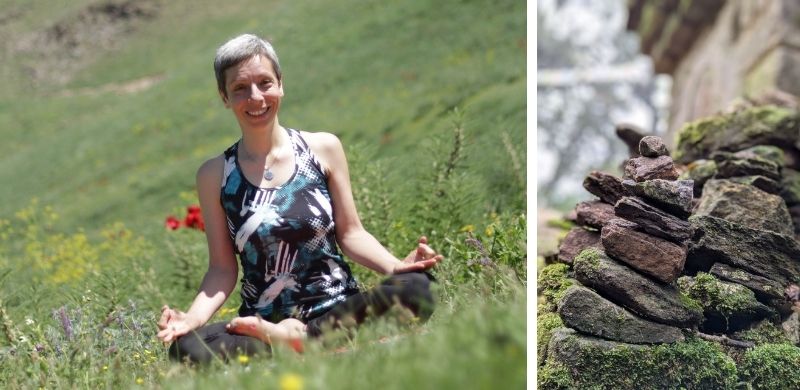 An image of a woman meditating in nature with a green and flower-filled background, in a calm and focused posture. On the right, a pile of stones symbolizing stability and balance.